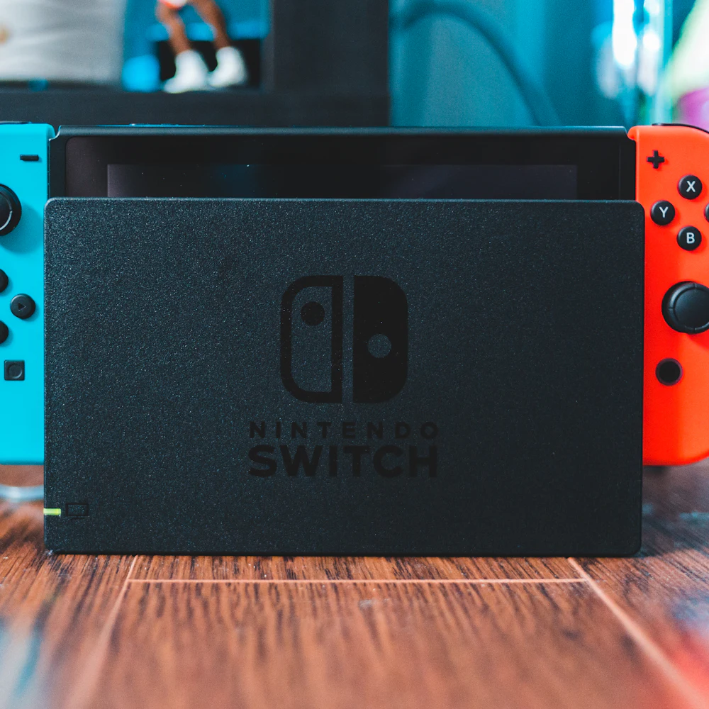 Nintendo Switch V2 in dock with neon red and blue Joy-Con controllers