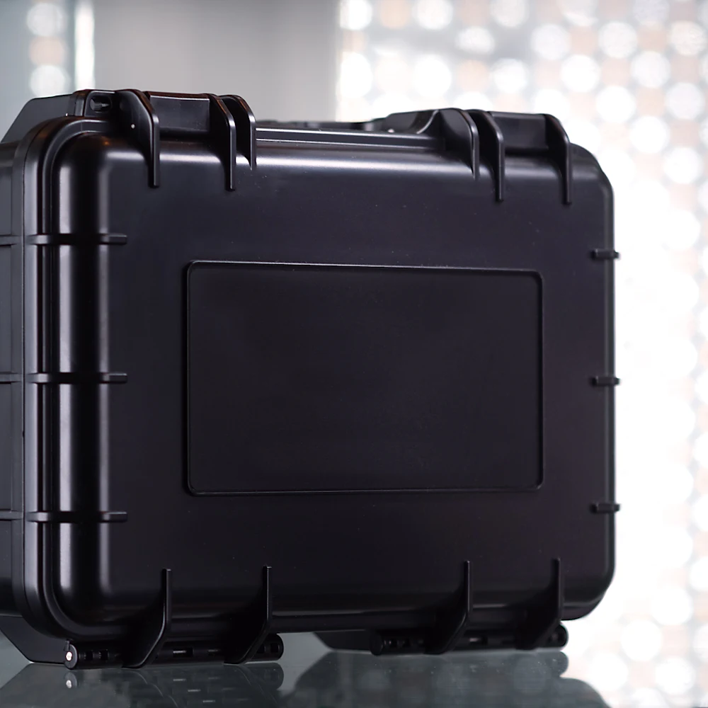Closed premium black hard case on a table