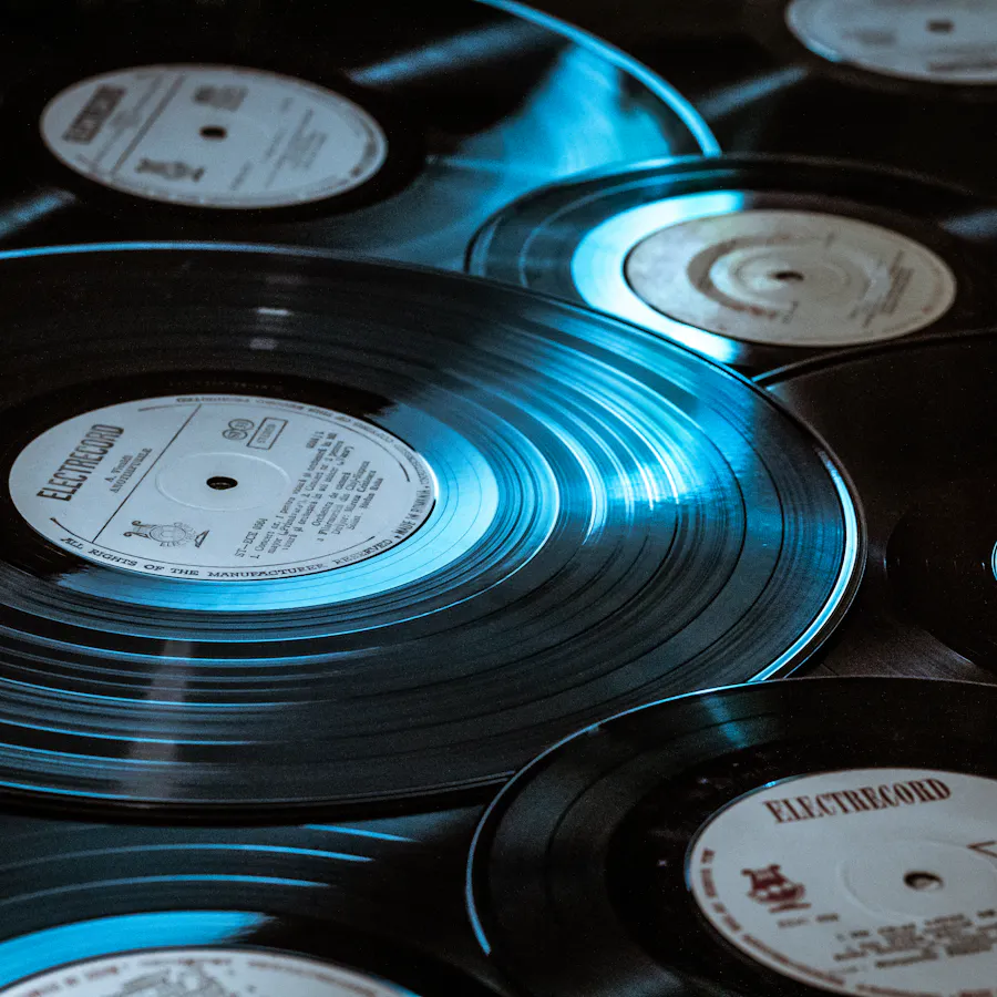 Close-up of vinyl records under dramatic blue lighting